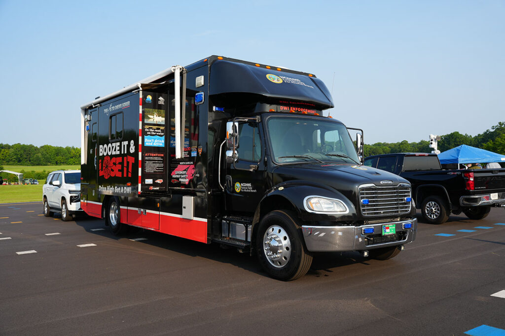 Black safety demonstration truck parked at the Technology Showcase
