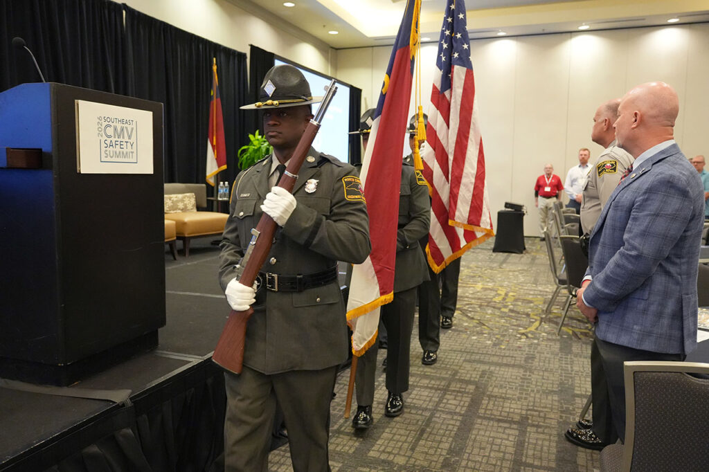 State trooper color guard beside the Summit stage