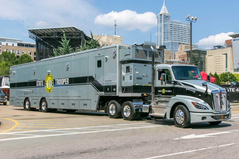 North Carolina State Highway Patrol State Trooper semi-truck and trailer on a city street